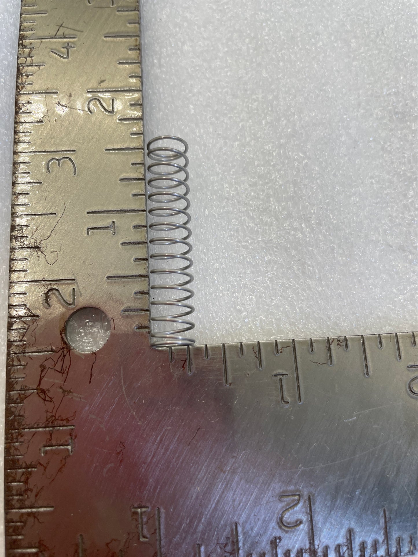 Spring for chute tongue